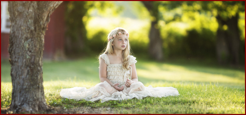 Gerald Fagan Photography child sitting outside in a dress